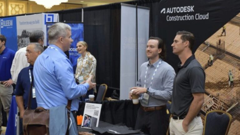 Sponsor representatives speaking with conference attendees
